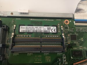 Remove screws from the metal cover and pull up - you can see the motherboard
