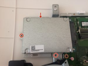 Now you can see motherboard, covered up by metal cover